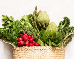 A variety of vegetables in a woven basket