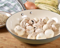 A pan holding mushrooms.